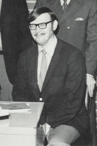 Walter Powell seated.
