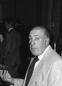 Tony Pagano holding a glass.