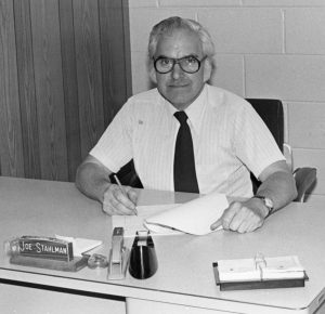 Jo Stahlman sitting at a desk